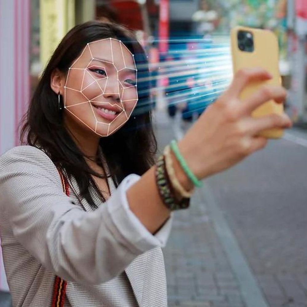 Girl scanning her face using the App