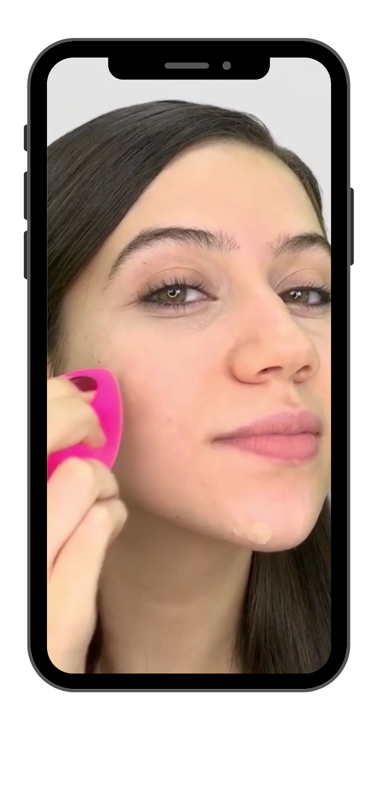 A model demonstrating techniques for concealing facial acne.