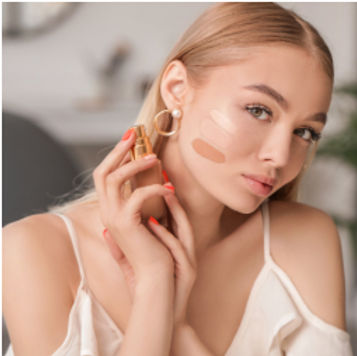 beautiful girl using foundation